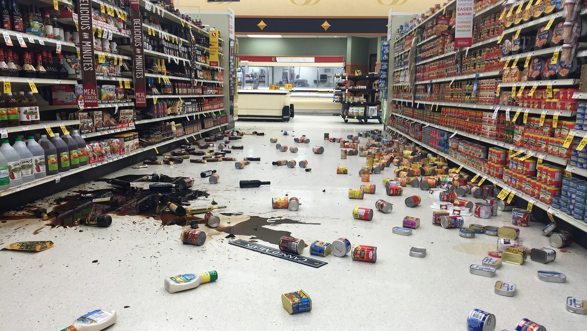 a blurred image of a store with a lot of trash on the floor